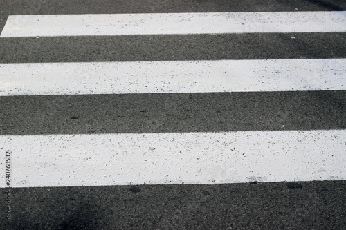 Crosswalk crossing stripes zebra white paint surface texture detail