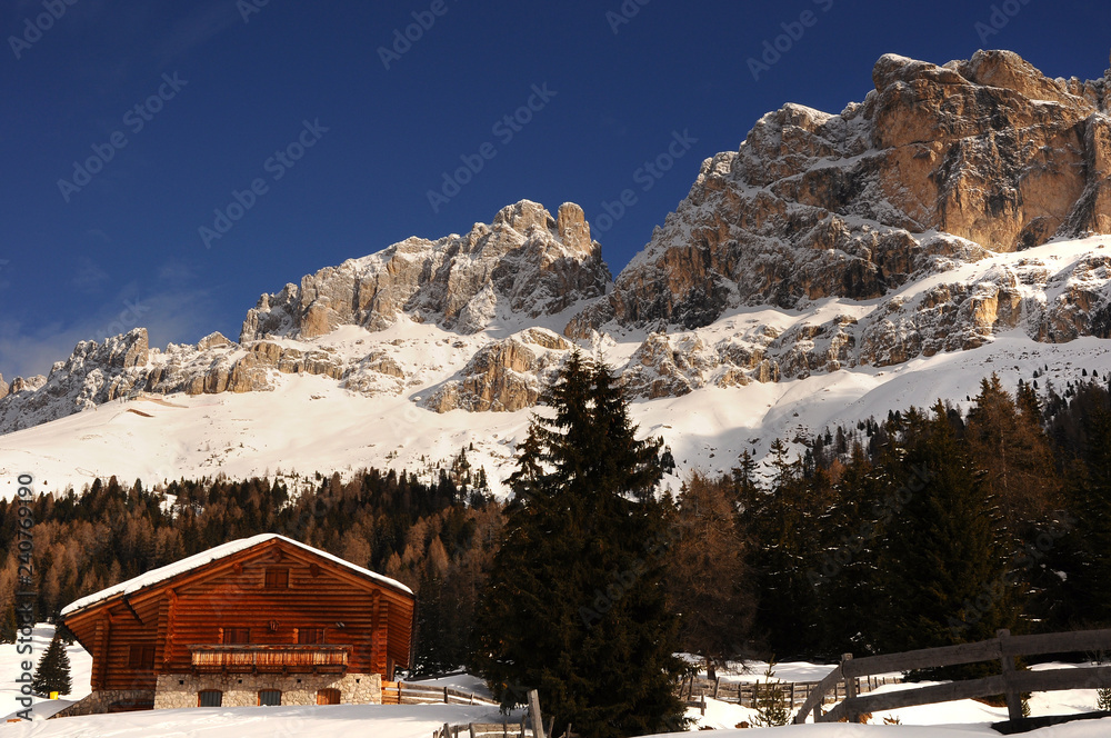 Winter landscape at Passo of Costalunga in the Italian Dolomites. The mountains group of Catinaccio. Northern Italy.