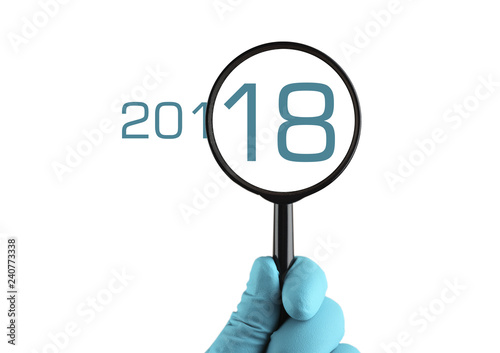 2018 year under magnification. Isolated on white background.
