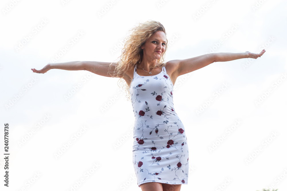 Young Attractive Blonde Girl Spreading Her Arms Young Attractive Blonde Girl Spreading Her Arms
