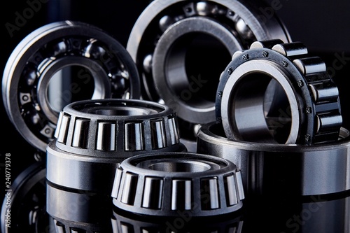 Close-up of a set of ball and roller bearings on a dark background