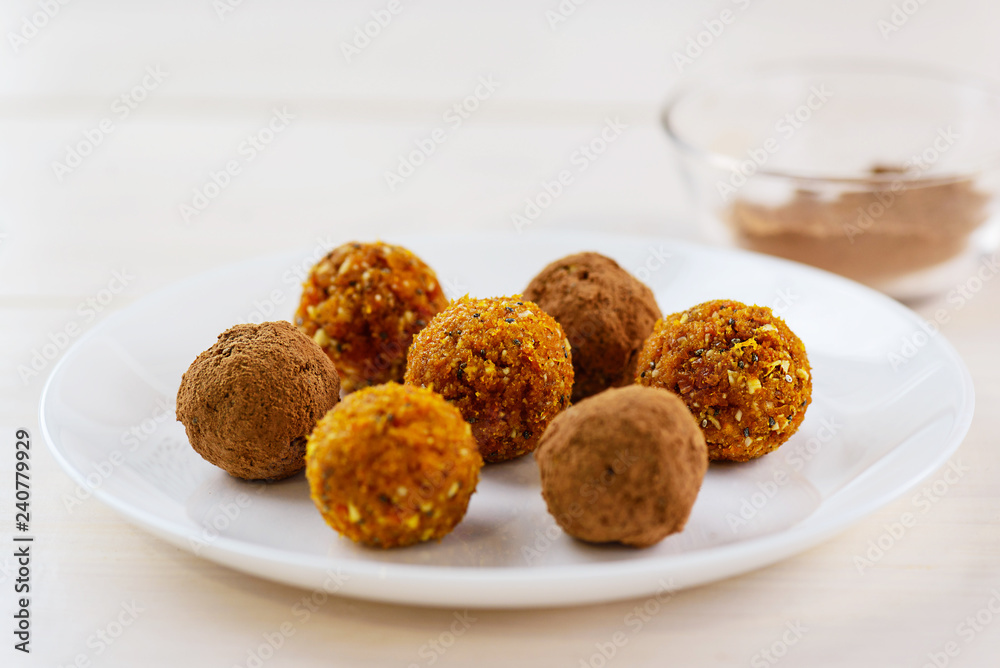 Candy of dried fruits and nuts on a white plate Candy of dried fruits and nuts on a white plate