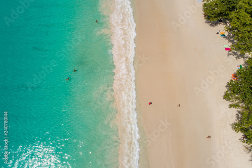 Fototapeta Naklejka Na Ścianę i Meble -  Aerial view of sandy beach with tourists swimming in beautiful clear sea water