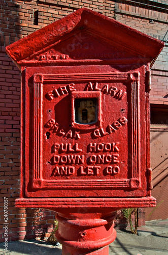 Old Fire Pullbox from bygone era on San Francisco Waterfront.  Some of these boxes are still in use today with some dating back to the 1860s. photo