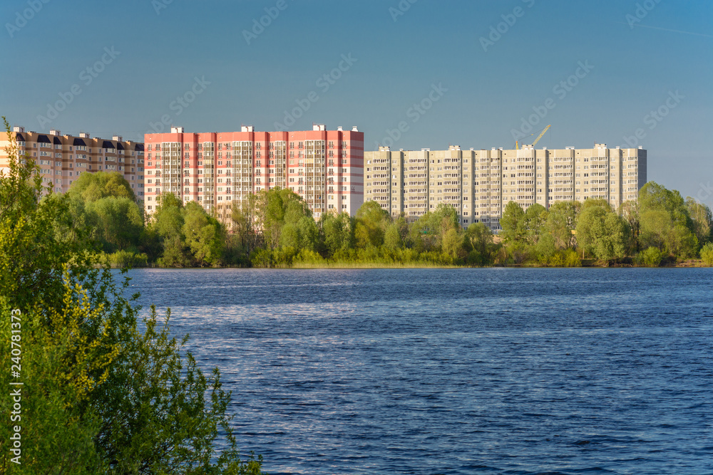 Gomel. Belarus. View of the neighborhood Swedish hill from the lake in the spring.