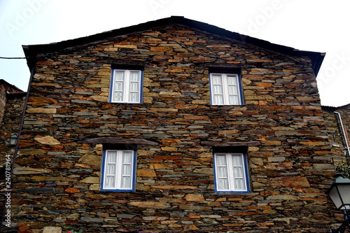 Photos Rustic hand-hewn wood window set into a stone wall built from schist in Piodão, made of shale rocks stack, one of Portugal's schist villages in the Aldeias do Xisto