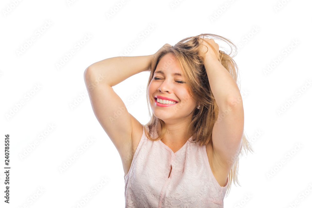 Young beautiful blonde woman holding both hands on her head vseorozhiv hair smiling, filming close-up on an isolated background Young beautiful blonde woman holding both hands on her head vseorozhiv hair smiling, filming close-up on an isolated background
