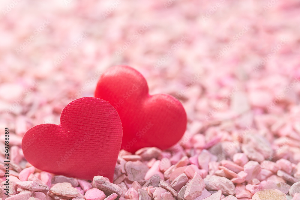 Two hearts on pink stones. Concept of love for Valentine's Day Two hearts on pink stones. Concept of love for Valentine's Day