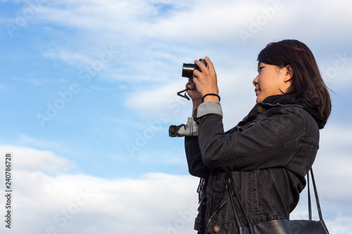 Chinese Girl Taking Picture With Her Photo Camera