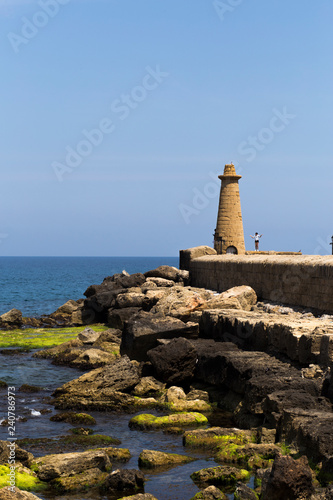 lighthouse on coast of sea © Анна Кубашева
