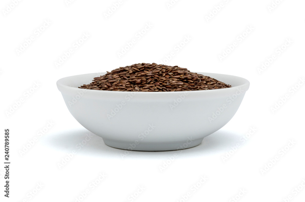 withe bowl with ground flaxseed withe bowl with ground flaxseed