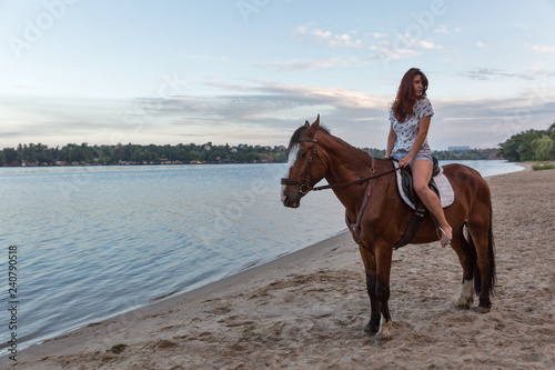 horse and young beautiful woman on river beach © Panama