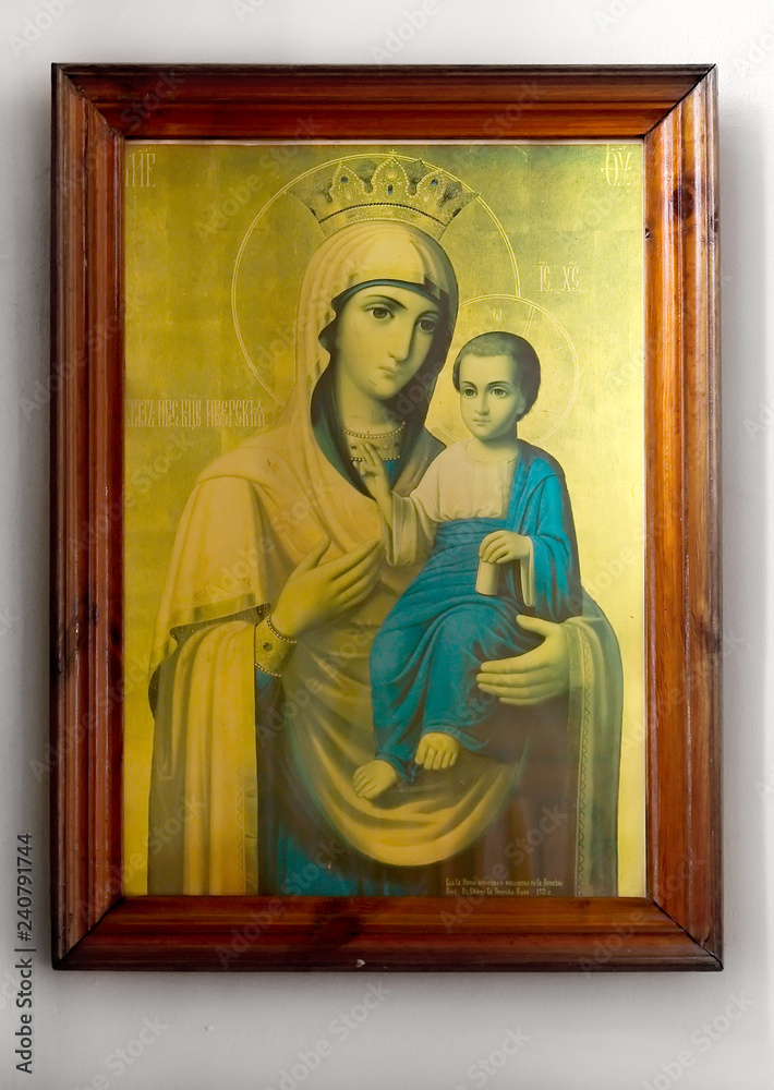 Old wooden icon on white background baby jesus and virgin mary