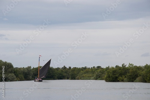 Traditional British sailing boat: a Norfolk Wherry, on a grey day