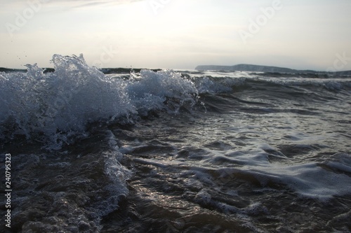 Bubbles and spray on a breaking wave, south coast of England
