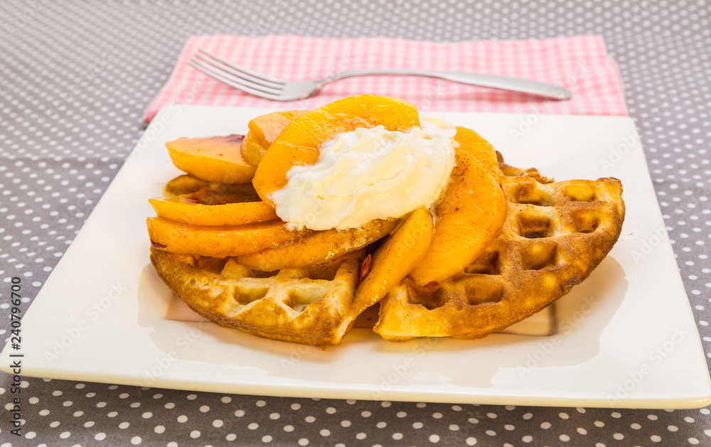 Peaches and Whipped Cream on Golden Brown Waffles Peaches and Whipped Cream on Golden Brown Waffles