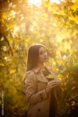 Beautiful girl in autumn garden