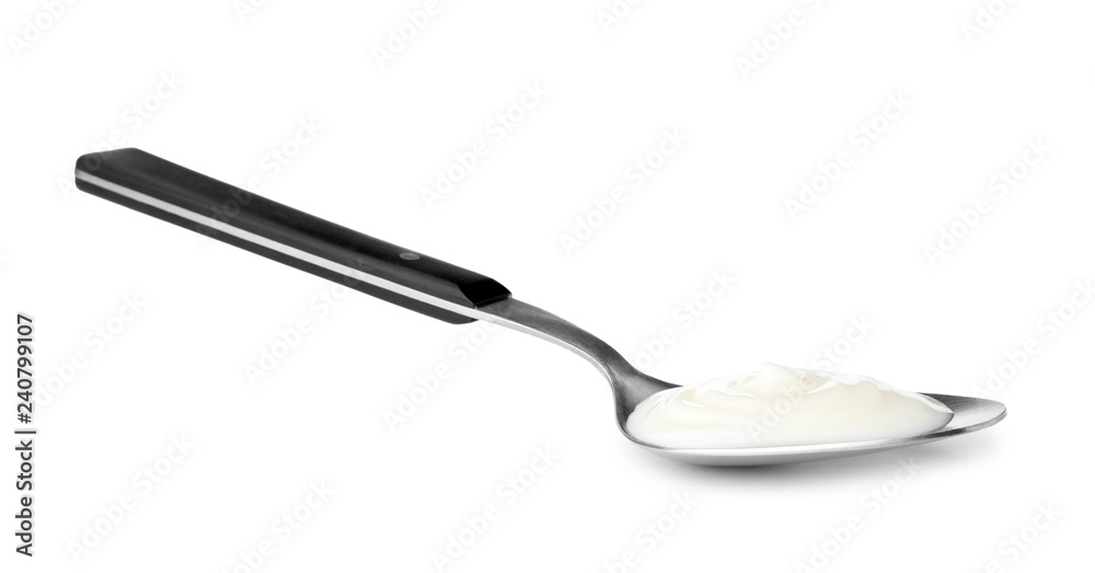 Metal spoon with sour cream on white background Metal spoon with sour cream on white background