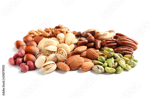 Pile of mixed organic nuts on white background