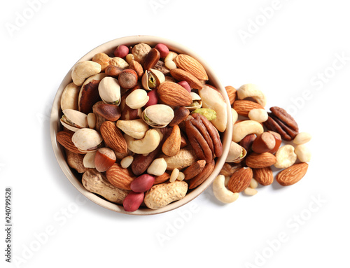 Bowl with mixed organic nuts on white background, top view