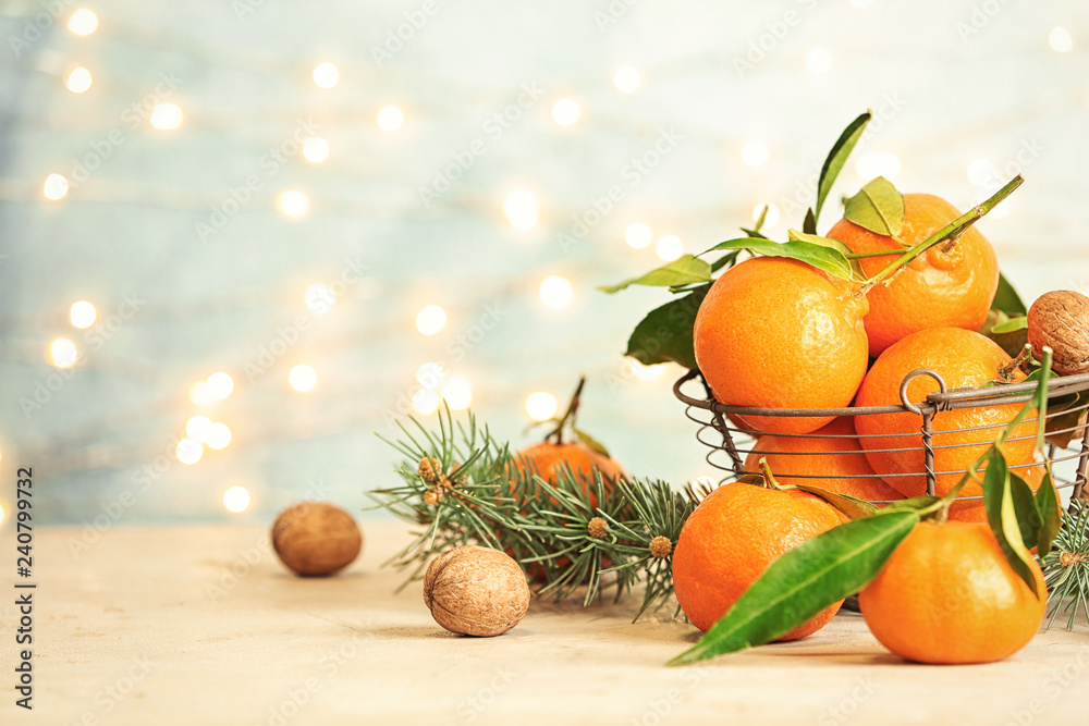 Christmas composition with ripe tangerines on table. Space for text