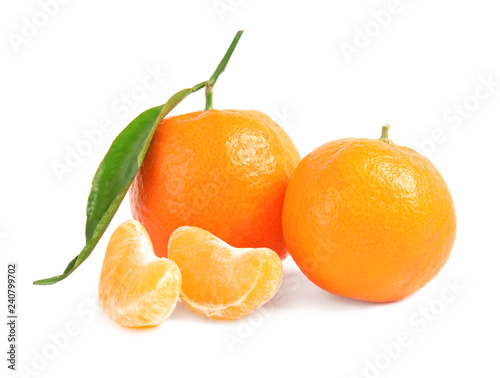 Tasty ripe tangerines on white background. Citrus fruit
