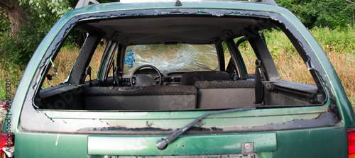 Destroyed car view trough the rear window. Vandalism conception
