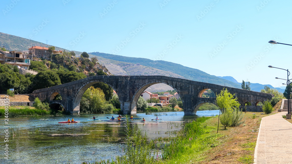 People Kayaking Under Arslanagic (Perovic) Bridge in Trebinje, Bosnia and Herzegovina (04.08.2018)