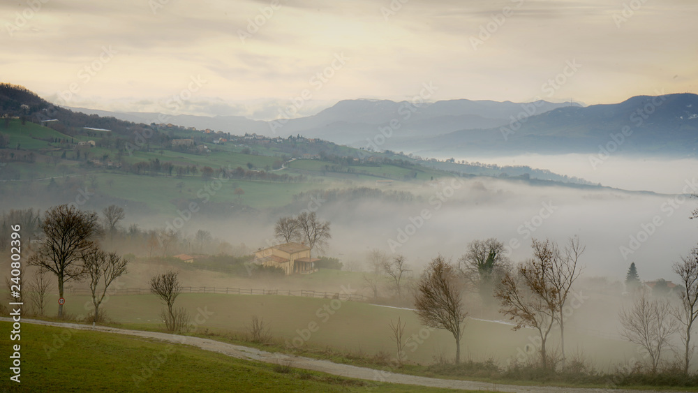 low clouds on italian countryside
