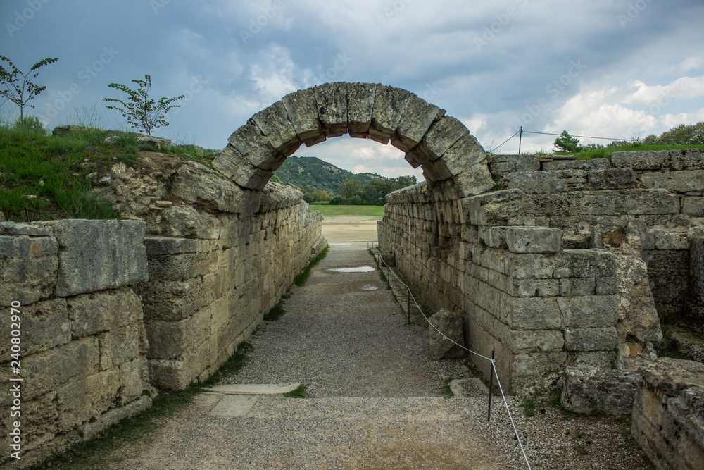 world heritage site with ancient stone building arch shape alley way corridor from Roman Empire times, tourist concept