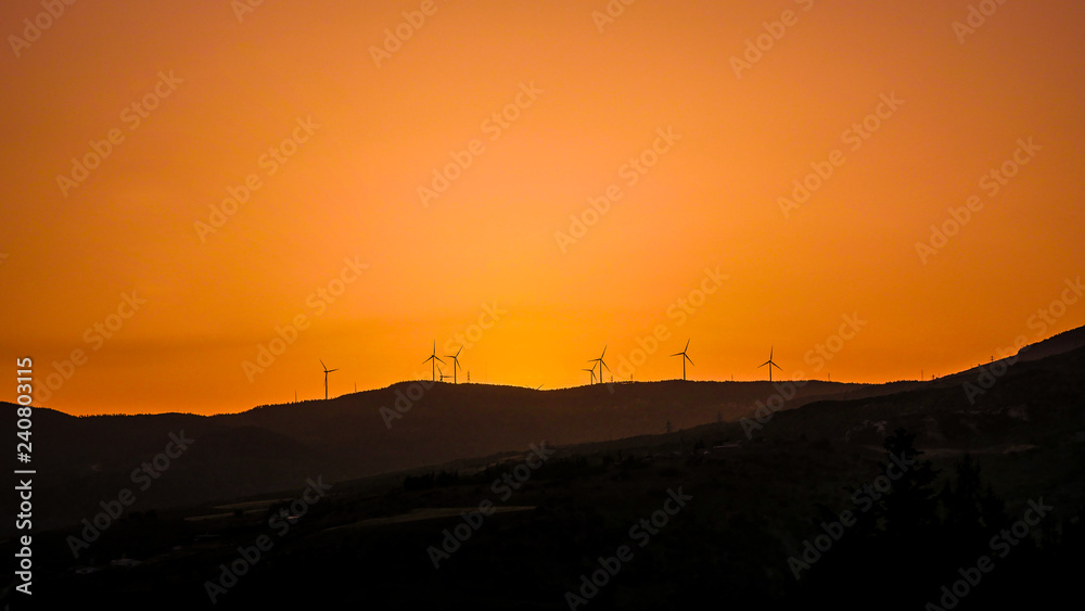 sunset and windmills