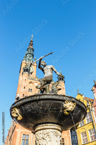 Fountain of the Neptune at sunny day. Old town of Gdansk, Poland
