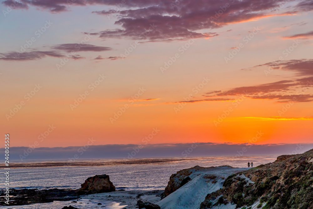 Fototapeta premium Orange Sunset Along Beach