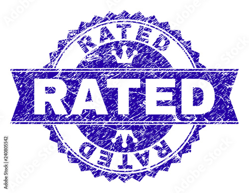 RATED rosette seal overlay with grunge effect. Designed with round rosette, ribbon and small crowns. Blue vector rubber watermark of RATED label with grunge texture.