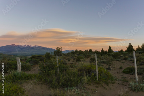 Orange lenticular clouds on sunset during spring season in Patagonia.