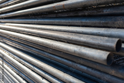 Stack of steel pipes for the construction of scaffolding.