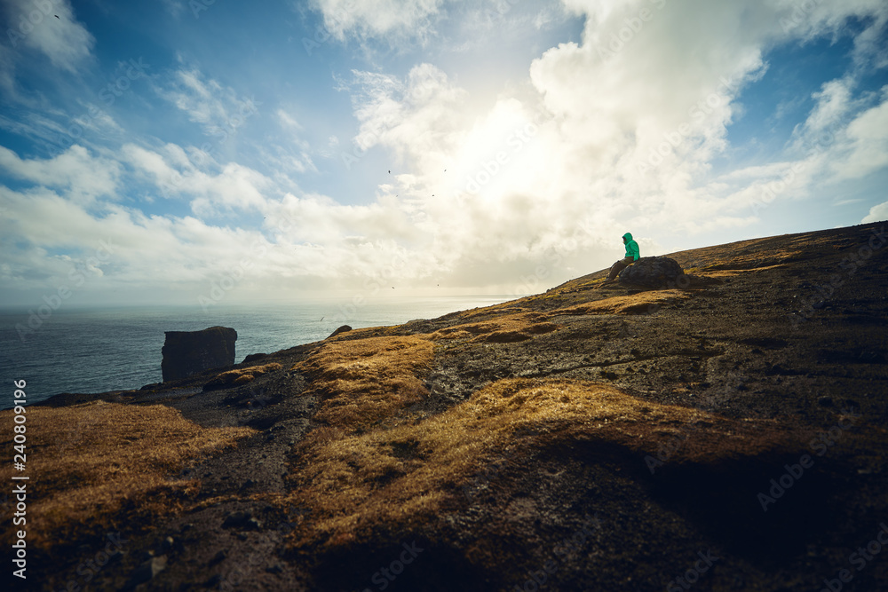 Woman alone at Dyrhólaey, Iceland