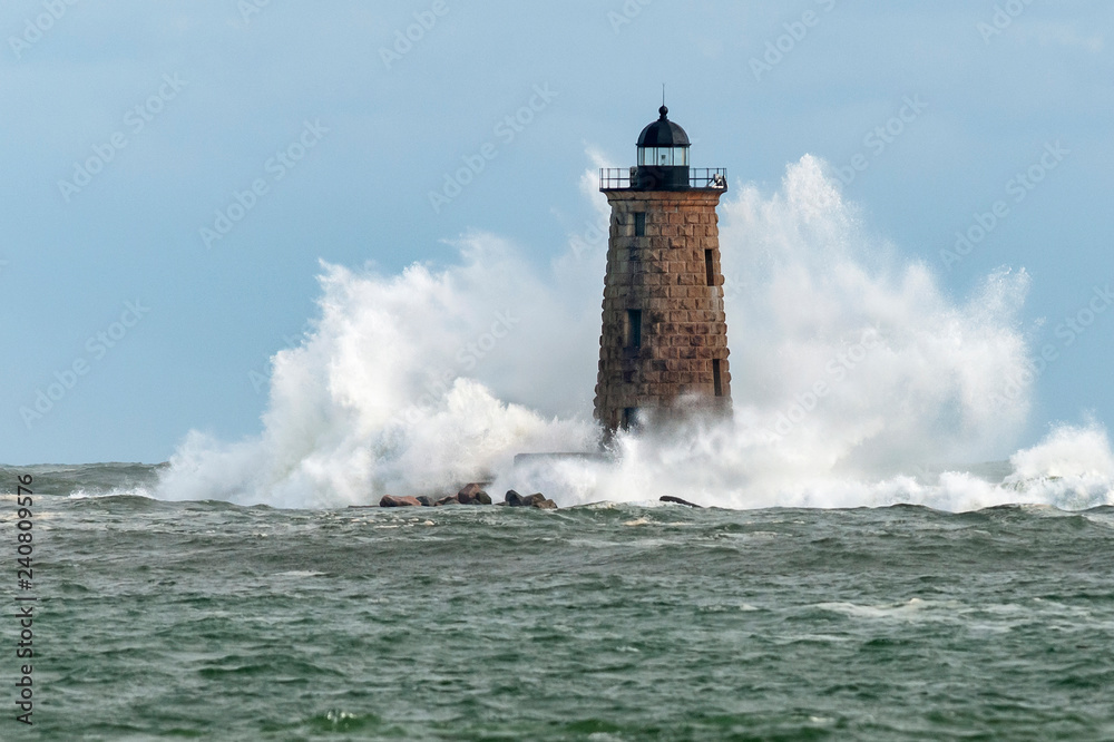 Giant Waves Surround Stone Lighthouse Tower in Maine