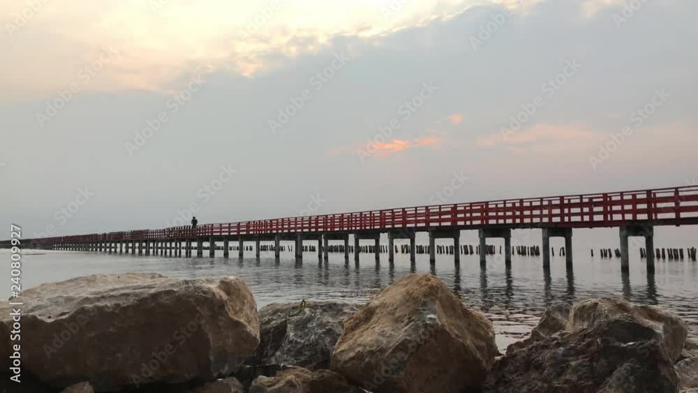 Long Red Bridge sunlight sky tree at beach sea,Red bridge Samut Sakhon Thailand Long Red Bridge sunlight sky tree at beach sea,Red bridge Samut Sakhon Thailand