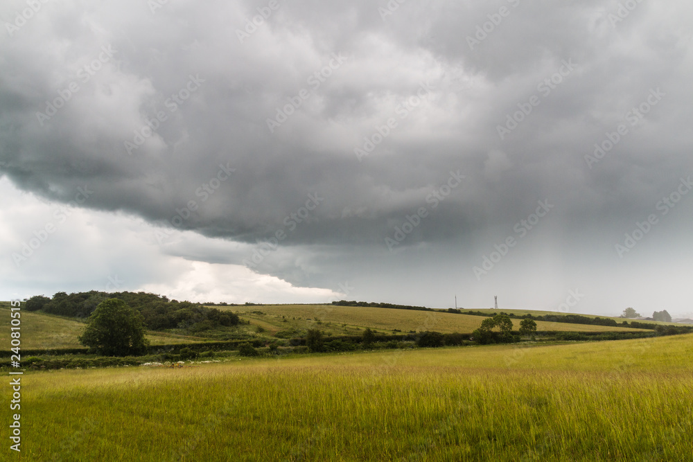Rainstorm Over Field In Meadow Rainstorm Over Field In Meadow