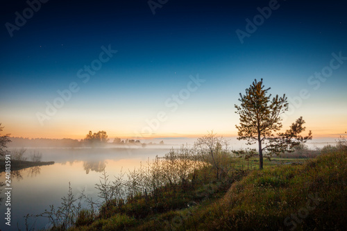 River shore, fog on the water and starry sky