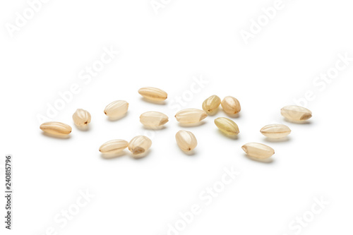 Fotografie Brown rice isolated on white background