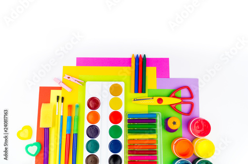 School accessories are laid out in the form of a rainbow. white background.