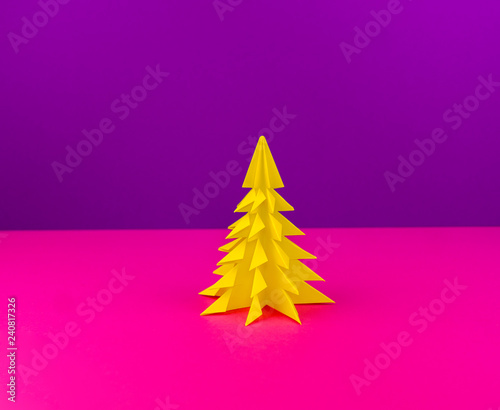 Christmas tree made of yellow craft paper.