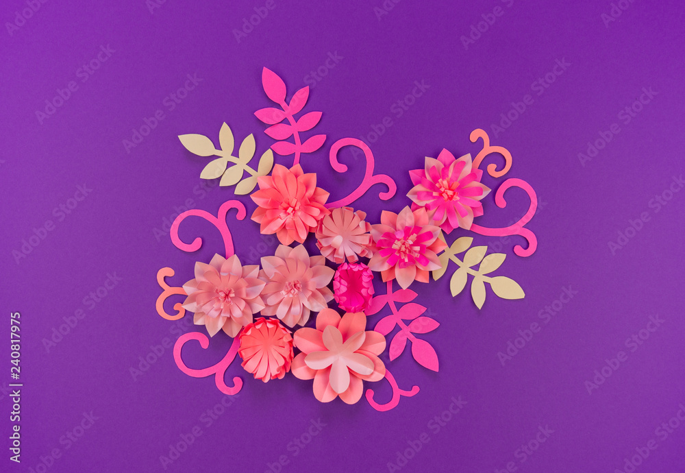 Flower made of coral color paper. The pink color of the curl and leaf.