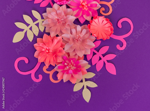 Flower made of coral color paper. The pink color of the curl and leaf. © Дарья Колпакова