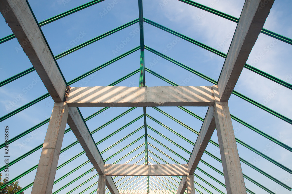 Structure of steel and concrete for building construction on blue sky background. Structure of steel and concrete for building construction on blue sky background.
