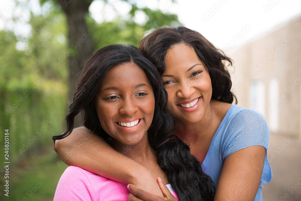 Portrait of an African American mother and her daugher.