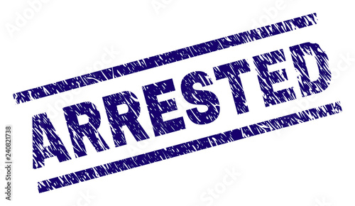 ARRESTED seal print with scratced style. Blue vector rubber print of ARRESTED title with dust texture. Text title is placed between parallel lines.