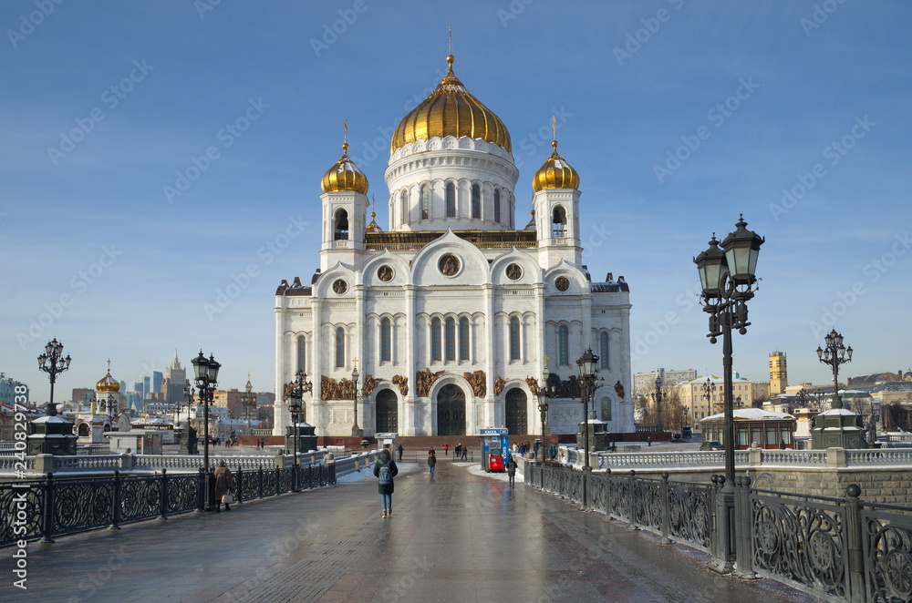 Moscow, Russia - January 25, 2018: Cathedral of Christ the Saviour and Patriarchal bridge on a Sunny winter day